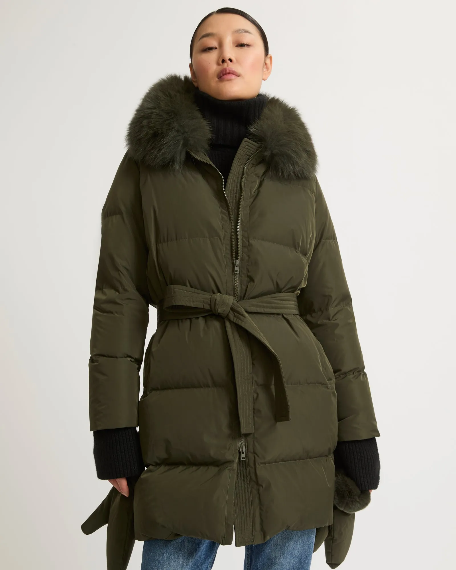 Long belted down jacket in technical fabric with fur collar